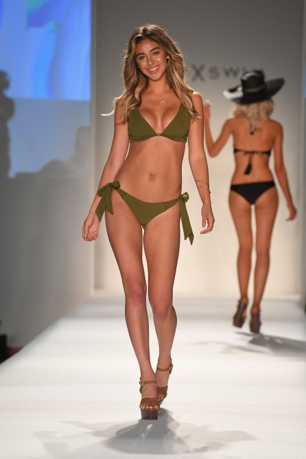 MIAMI, FL - JULY 21: A model walks the runway during the SWIMMIAMI Prey Swim by Audrina Patridge Resort 2018 Collection fashion show at The Tent on July 21, 2017 in Miami, Florida. (Photo by Rodrigo Varela/Getty Images for Prey Swim By Audrina Patridge)